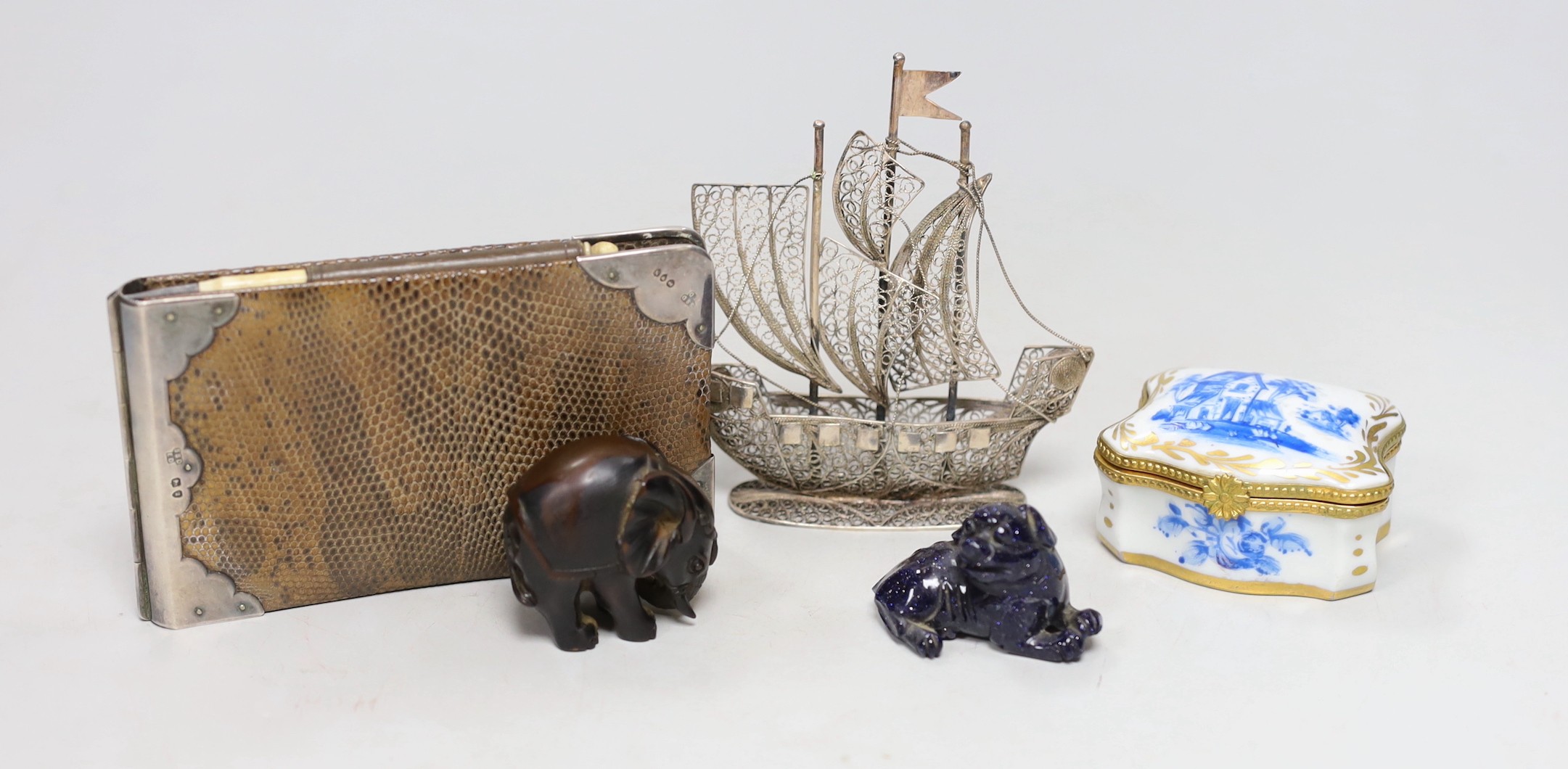 A silver mounted hinged folding wallet, 7.5 x 12cm, together with a filigree ship, a gilt and blue Limoges box and two animal figures